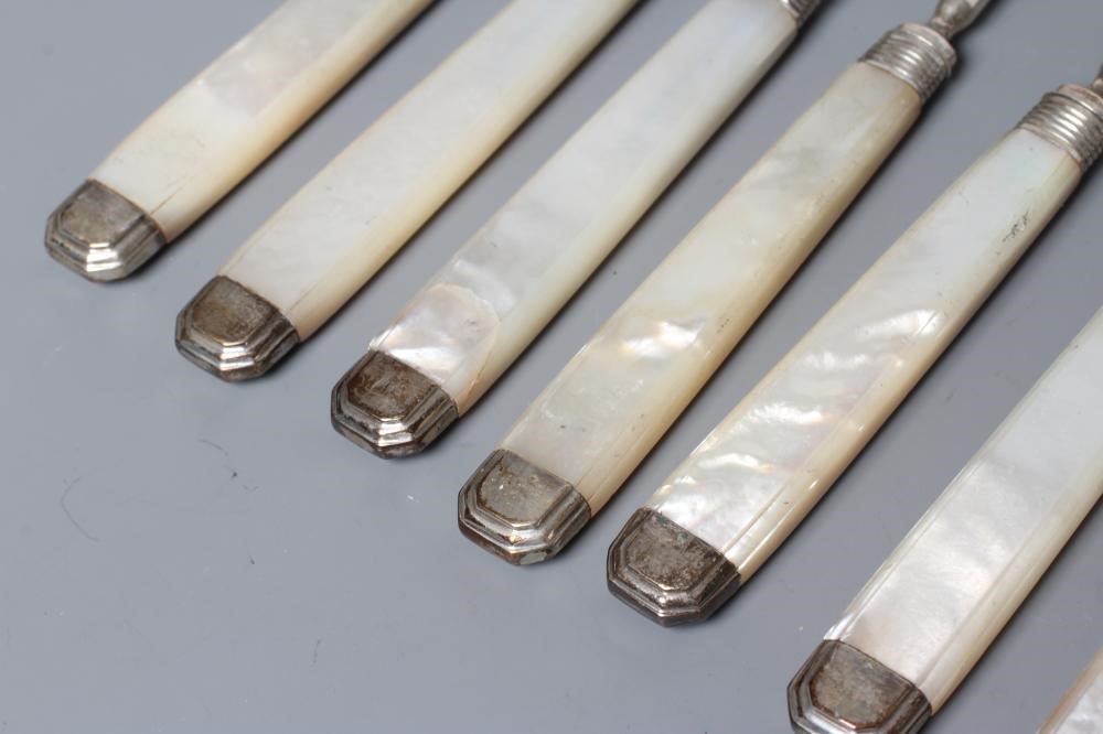 A SET OF TWELVE PAIRS OF FRUIT KNIVES AND FORKS Image