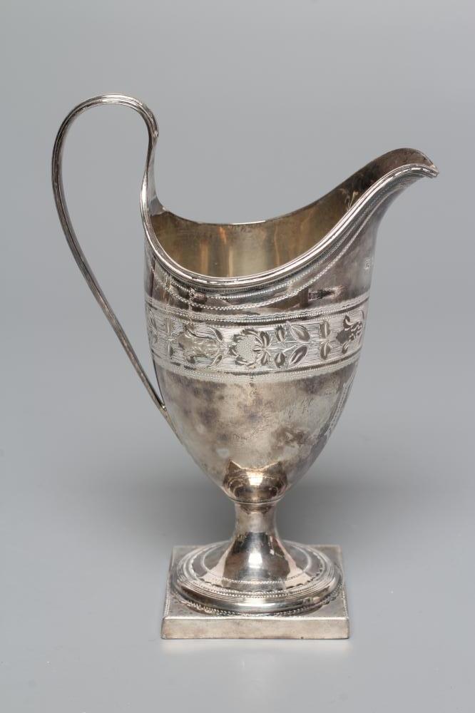 A LATE GEORGE III SILVER HELMET MILK JUG Image