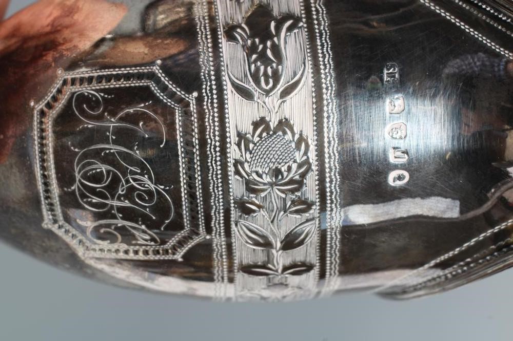 A LATE GEORGE III SILVER HELMET MILK JUG Image