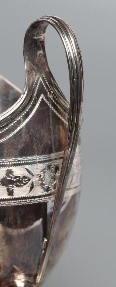 A LATE GEORGE III SILVER HELMET MILK JUG Image