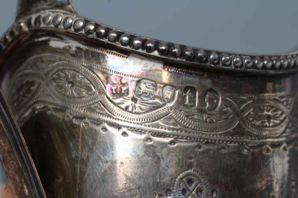 A VICTORIAN SILVER HELMET MILK JUG Image