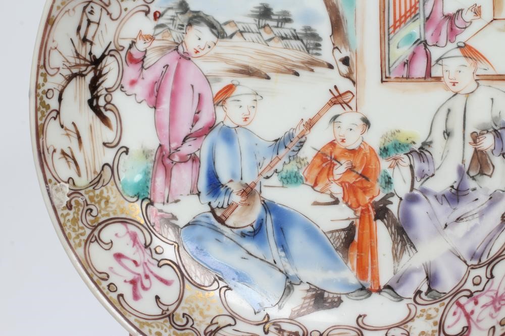 A CHINESE PORCELAIN SAUCER centrally painted in coloured enamels with a boy seated at a window Image