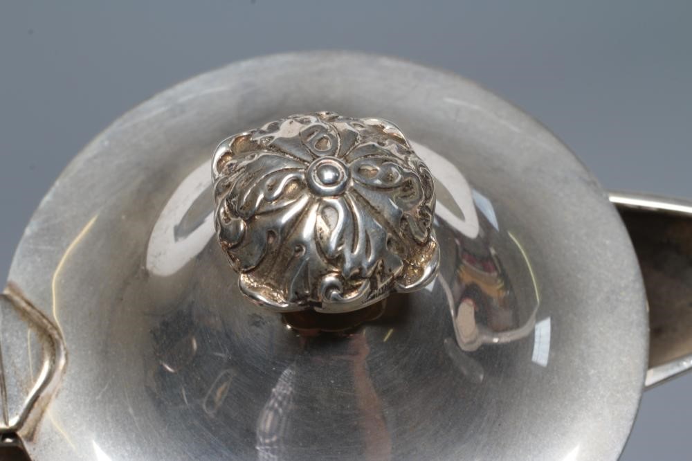 A LATE VICTORIAN SILVER HOT WATER JUG Image