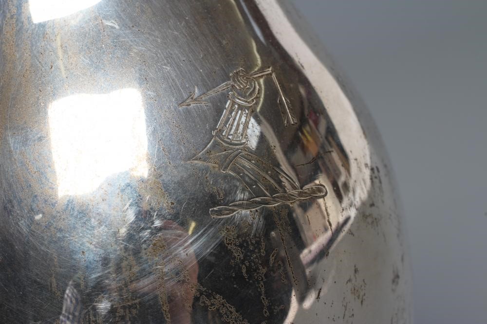 A LATE VICTORIAN SILVER HOT WATER JUG Image