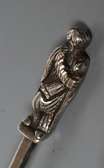 A LATE GEORGE III SILVER CADDY SPOON Image
