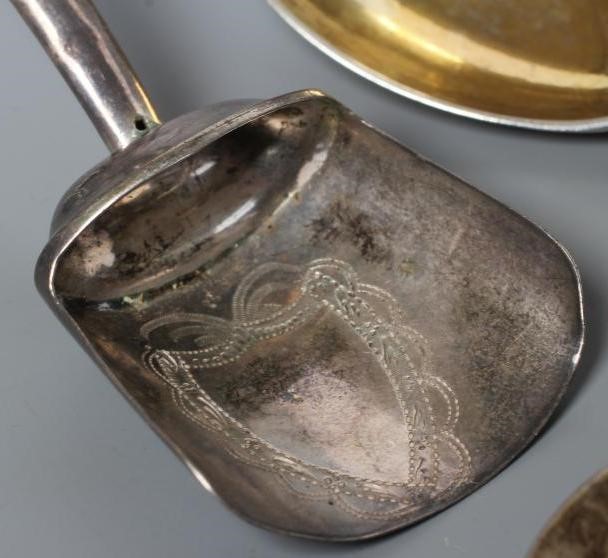A LATE GEORGE III SILVER CADDY SPOON Image
