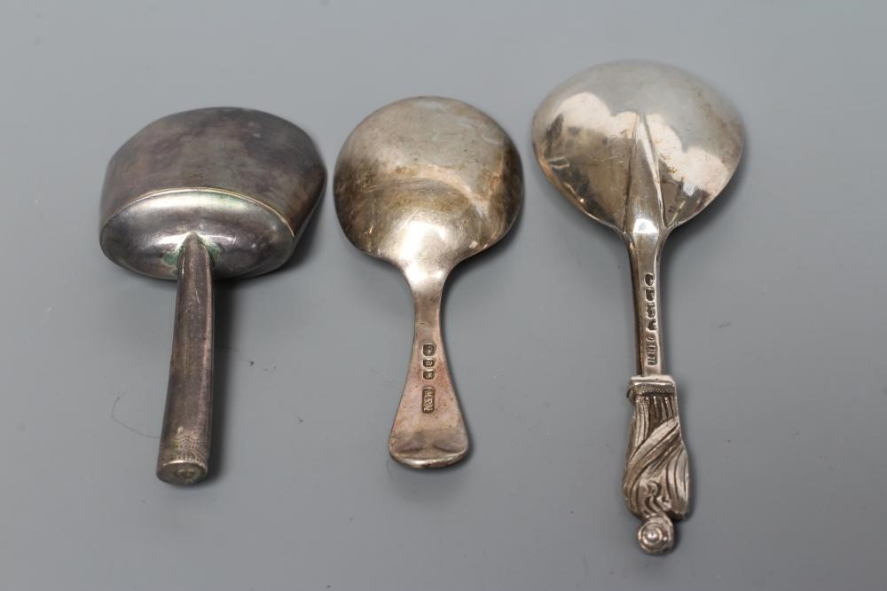 A LATE GEORGE III SILVER CADDY SPOON Image