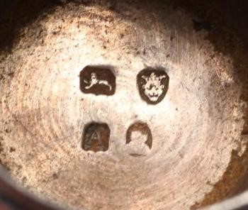 A LATE GEORGE III SILVER CAYENNE PEPPER CASTER Image