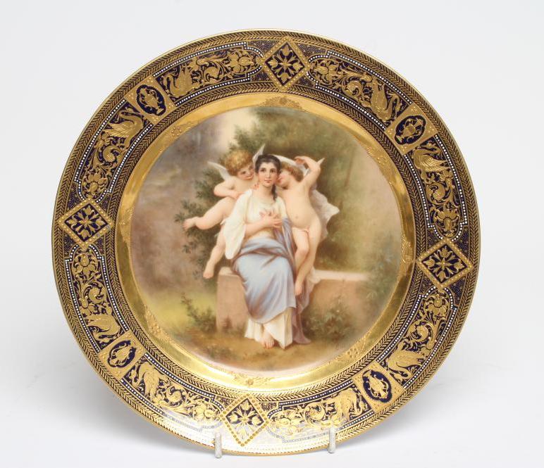 A VIENNA PORCELAIN CABINET PLATE centrally painted in polychrome enamels by Ens with 'L'eveil du Image