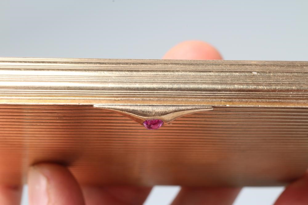 A 9CT GOLD CIGARETTE CASE of plain oblong form with ribbed exterior Image