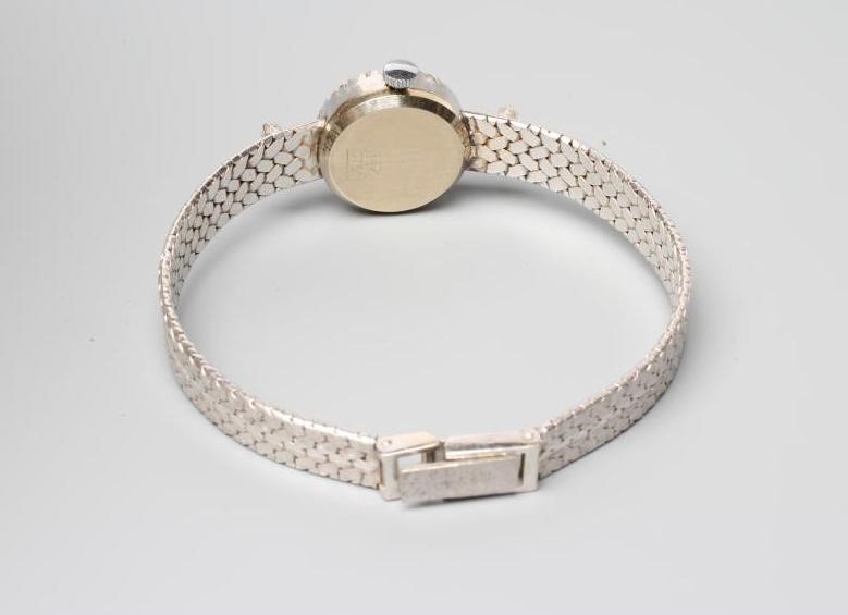 A LADY'S 18CT WHITE GOLD AND DIAMOND CURTIS WRISTWATCH Image