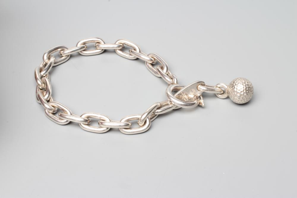 A GEORG JENSEN SILVER BRACELET, the thick links with golf ball fastener, London import 1991 (Est. Image