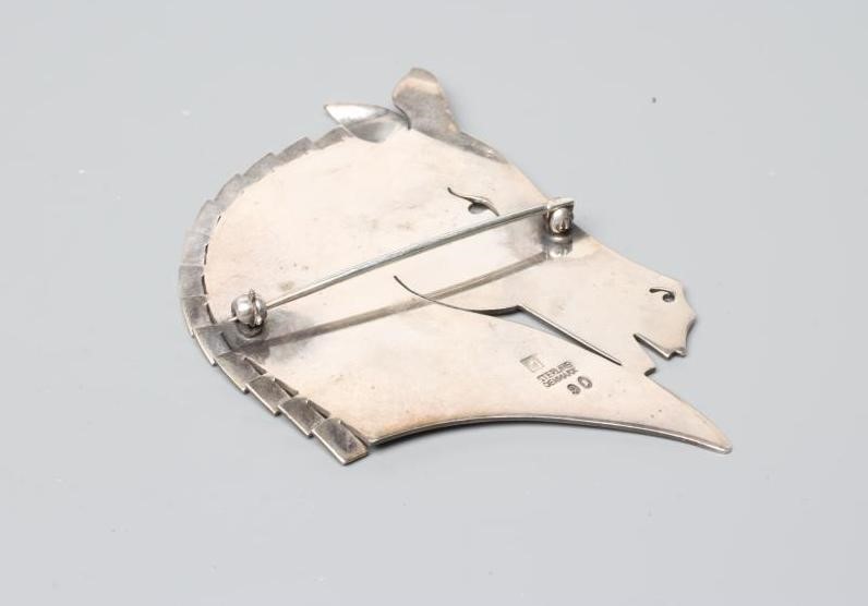 A GEORG JENSEN SILVER HORSE HEAD BROOCH designed by Arno Malinowski, stamped and numbered 90 (Est. Image