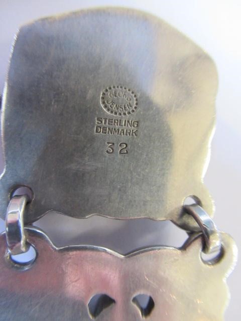 A GEORG JENSEN SILVER BRACELET designed by Jensen with shaped links cast and pierced with doves Image