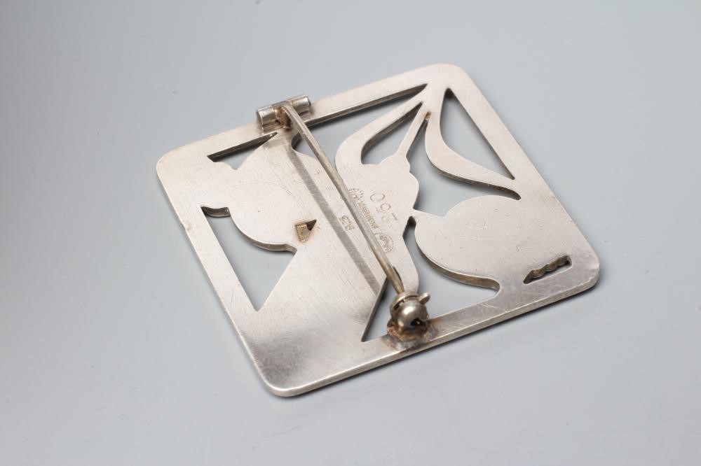 A GEORG JENSEN SILVER SQUARE BROOCH designed by Arno Malinowski as two birds with a wheat ear, Image