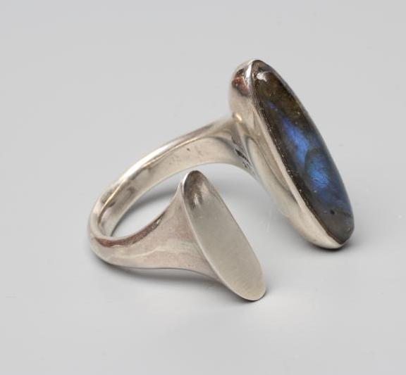 A GEORG JENSEN SILVER DRESS RING designed by Bent Gabrielsen with a polished Labradorite, stamped Image