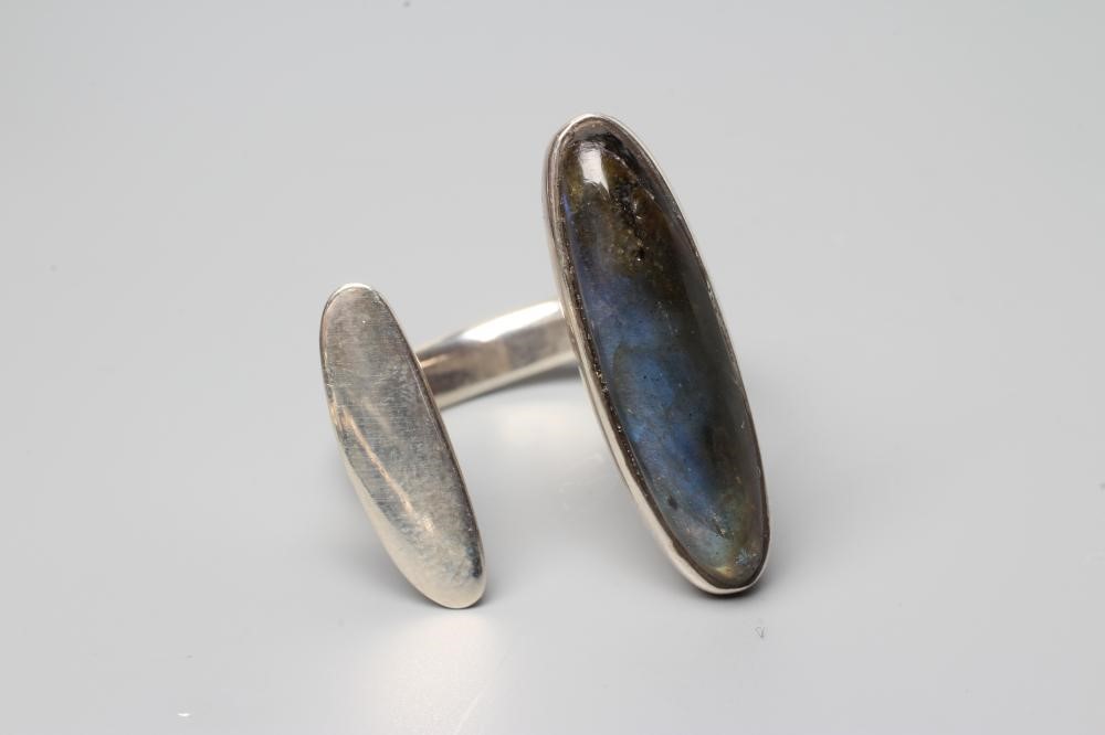 A GEORG JENSEN SILVER DRESS RING designed by Bent Gabrielsen with a polished Labradorite, stamped Image