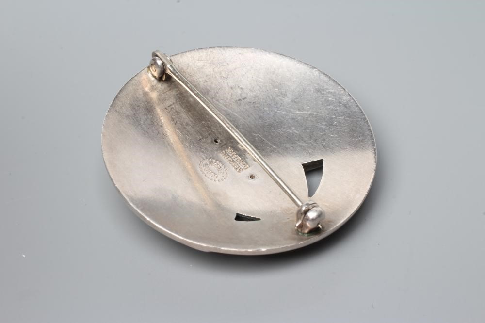 A GEORG JENSEN SILVER BROOCH of circular domed form cast and pierced with a stylised flowerhead with Image
