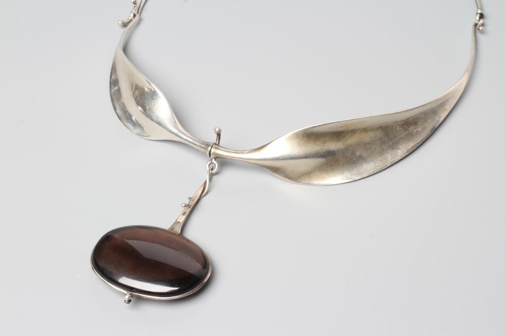 A GEORG JENSEN SILVER NECK RING designed by Viviana Torun Bulow-Hube Image