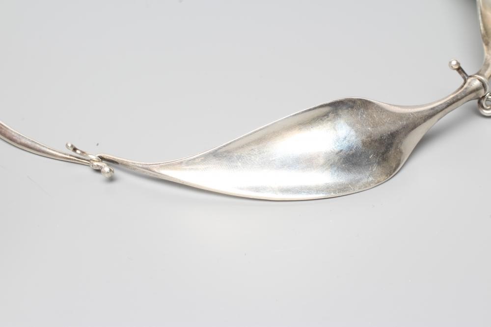 A GEORG JENSEN SILVER NECK RING designed by Viviana Torun Bulow-Hube Image