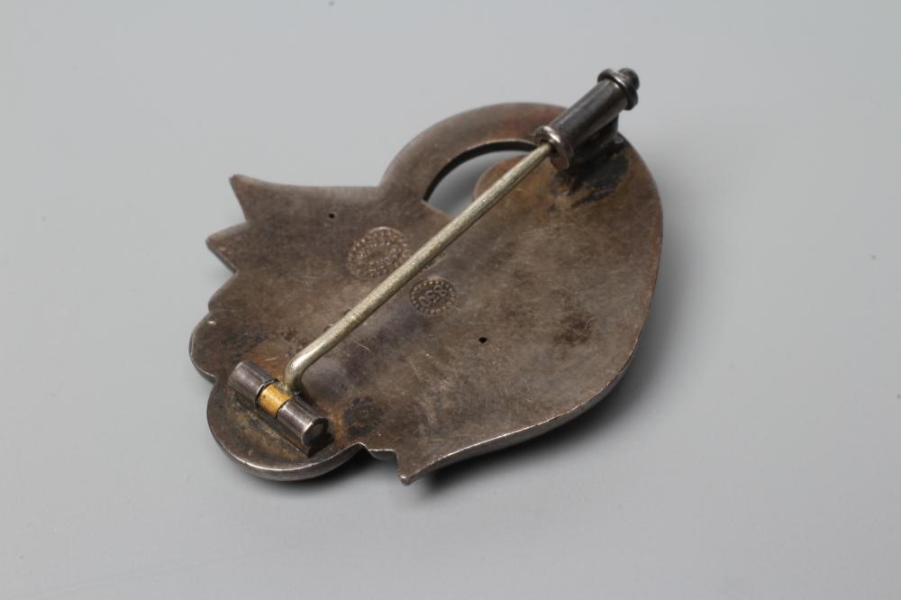 A GEORG JENSEN BROOCH cast as two stylised buds and centred by a circular polished moonstone, Image