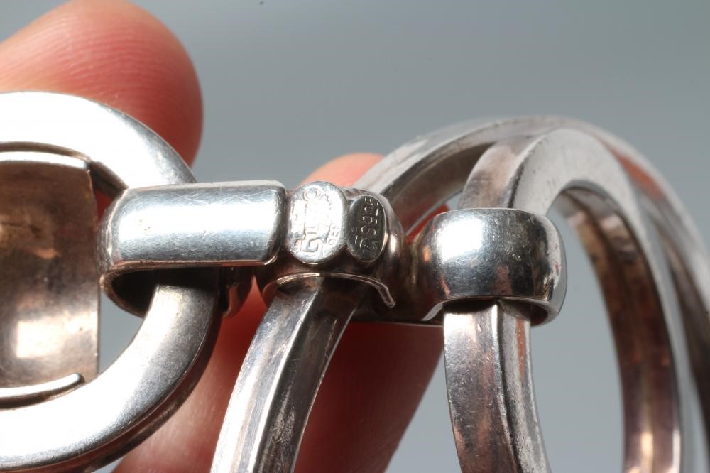 A GROSSE OF GERMANY SILVER PENDANT comprising two concentric circlets loose in mount on a fixed Image