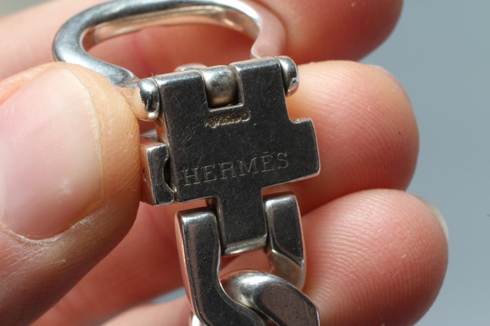 AN HERMES SILVER BRACELET, the flat curb links with buckle clasp, stamped HERMES, Ag 925 A*D Image
