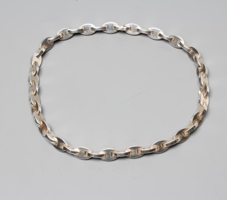 AN HERMES SILVER NECKLACE, the solid oval links with bar clasp, stamped HERMES, 925 and three other Image