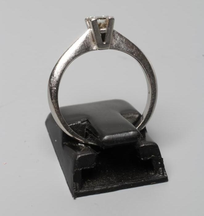 A SOLITAIRE DIAMOND RING, the Princess cut stone of 0.36cts, claw set to a plain platinum shank, Image