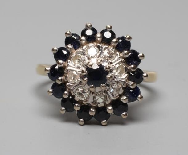 A SAPPHIRE AND DIAMOND CLUSTER RING Image