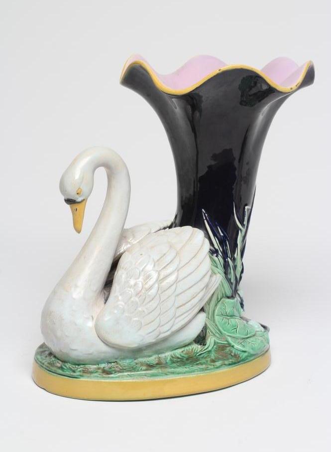 A LATE VICTORIAN JOSEPH HOLDCROFT MAJOLICA VASE modelled as a swan beside a blue glazed cornucopia Image