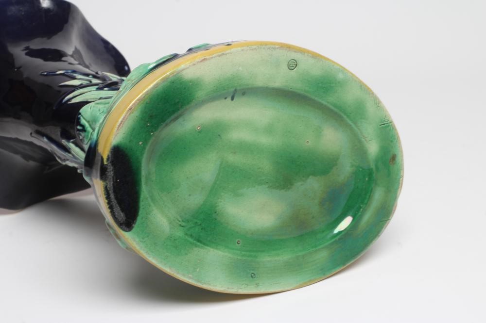 A LATE VICTORIAN JOSEPH HOLDCROFT MAJOLICA VASE modelled as a swan beside a blue glazed cornucopia Image