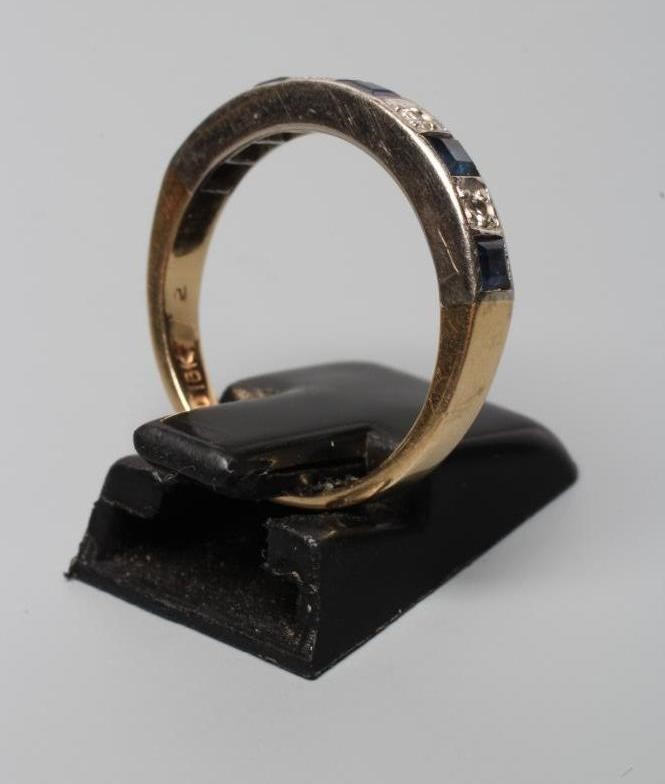 A SAPPHIRE AND DIAMOND HALF HOOP RING, the five square cut sapphires and four round cut brilliant Image