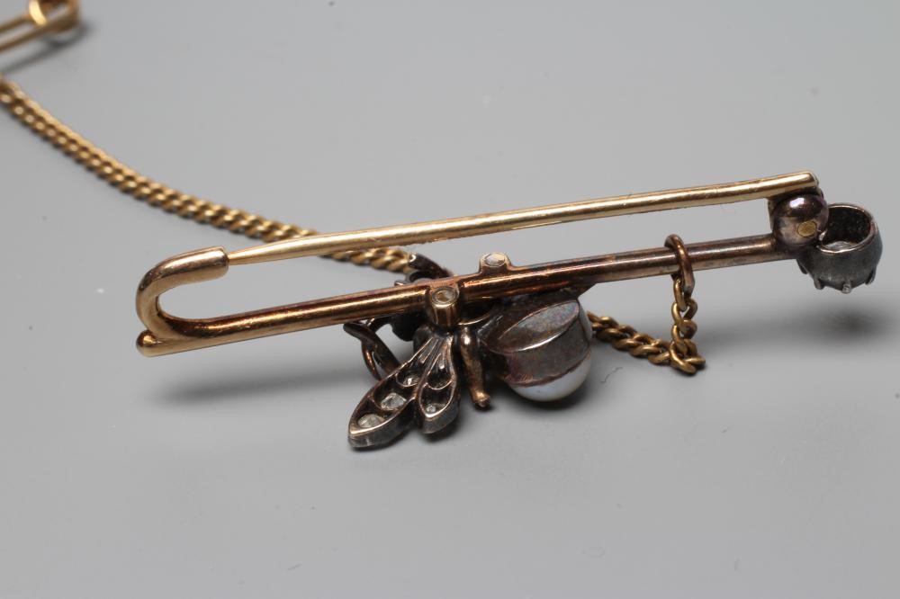 A VICTORIAN DIAMOND BEE BROOCH with pearl abdomen Image