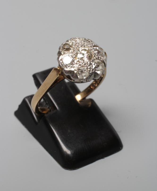 A DIAMOND CLUSTER RING, the mix cut stones illusion set to a plain shank, stamped BIRKS, 18k/14k, Image