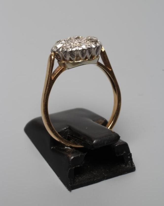 A DIAMOND CLUSTER RING, the mix cut stones illusion set to a plain shank, stamped BIRKS, 18k/14k, Image