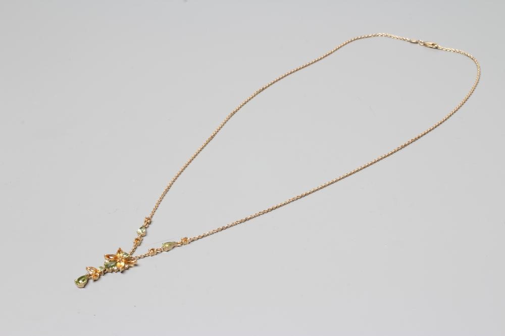 A CITRINE, PERIDOT AND AND DIAMOND FLOWER DROP PENDANT, fixed to a fine chain with two citrine and a Image
