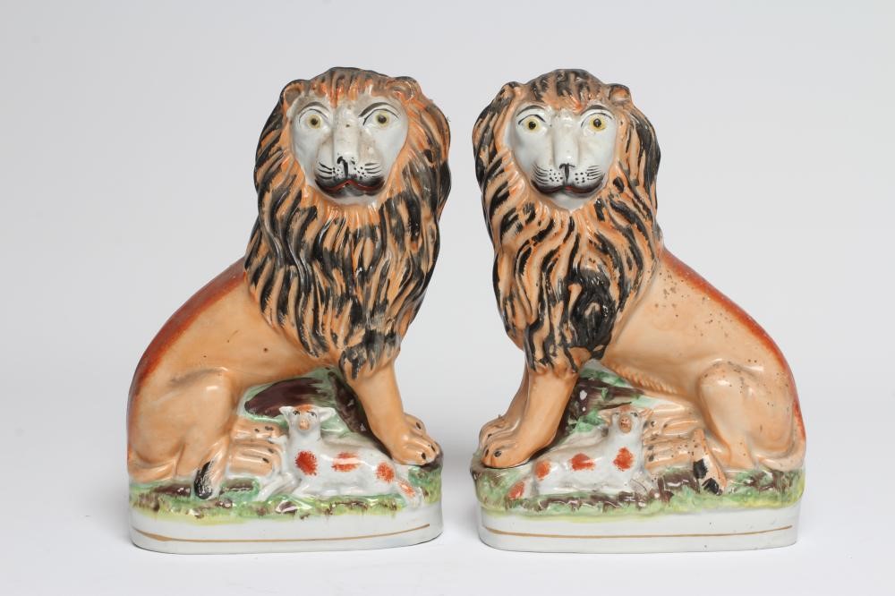 A PAIR OF VICTORIAN STAFFORDSHIRE POTTERY VAN AMBURGH LION AND LAMB FLATBACK MODELS, well moulded Image