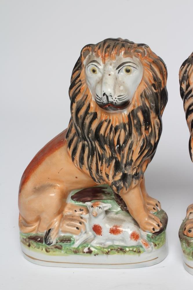 A PAIR OF VICTORIAN STAFFORDSHIRE POTTERY VAN AMBURGH LION AND LAMB FLATBACK MODELS, well moulded Image