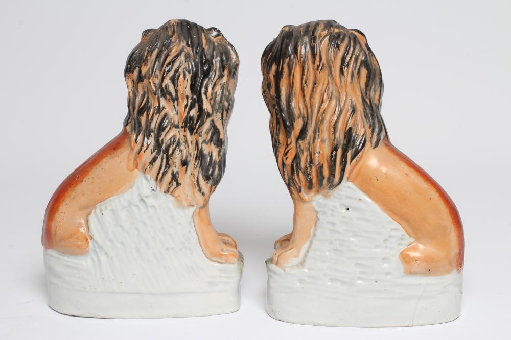 A PAIR OF VICTORIAN STAFFORDSHIRE POTTERY VAN AMBURGH LION AND LAMB FLATBACK MODELS, well moulded Image