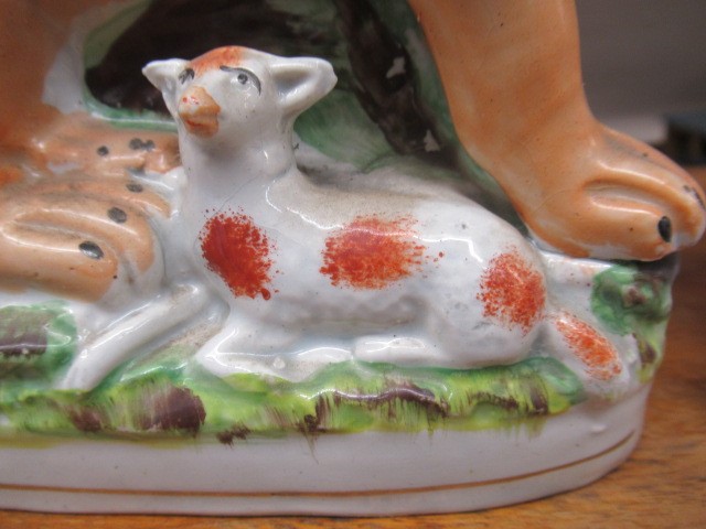 A PAIR OF VICTORIAN STAFFORDSHIRE POTTERY VAN AMBURGH LION AND LAMB FLATBACK MODELS, well moulded Image