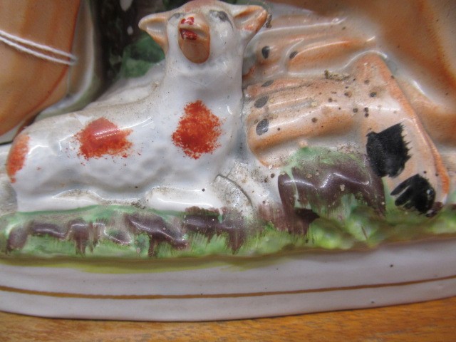 A PAIR OF VICTORIAN STAFFORDSHIRE POTTERY VAN AMBURGH LION AND LAMB FLATBACK MODELS, well moulded Image