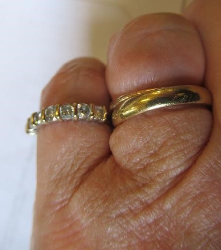 A SEVEN STONE DIAMOND HALF HOOP ETERNITY RING, the round brilliant cut stones line set to a plain Image