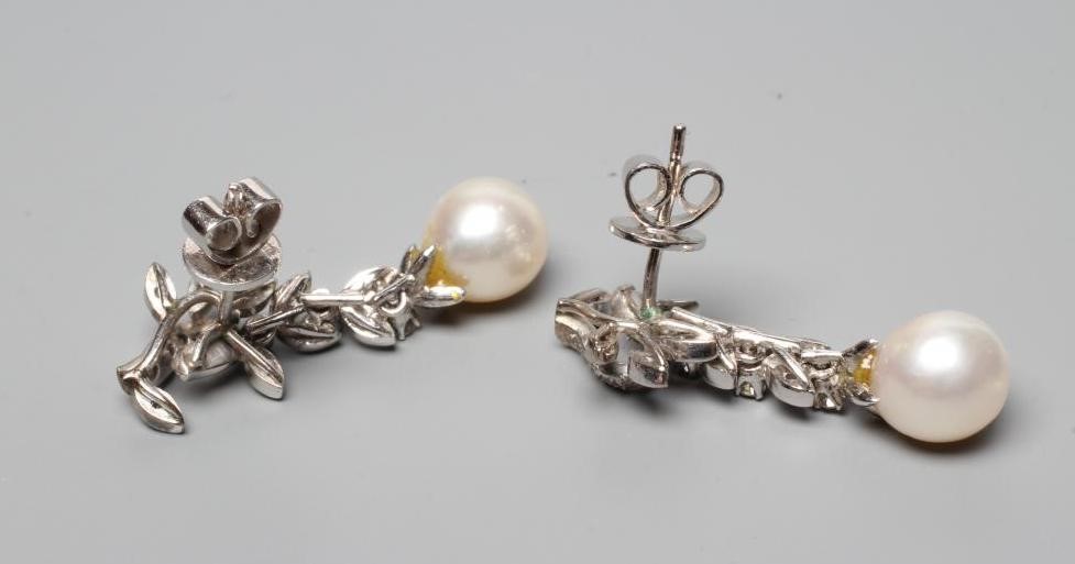 A PAIR OF PEARL AND DIAMOND EARRINGS, the cultured pearls pendant from a leafy branch to unmarked Image