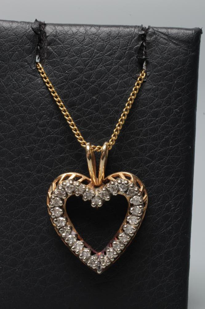 A DIAMOND OPEN HEART PENDANT, the twenty five small round brilliants point set to an unmarked frame Image