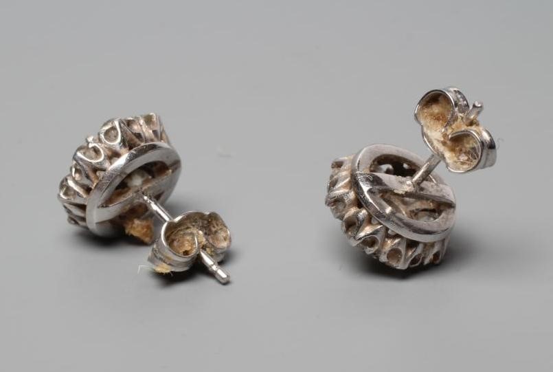 A PAIR OF DIAMOND CLUSTER EAR STUDS Image