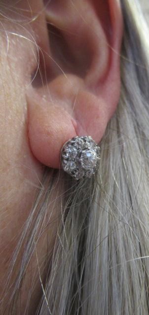 A PAIR OF DIAMOND CLUSTER EAR STUDS Image