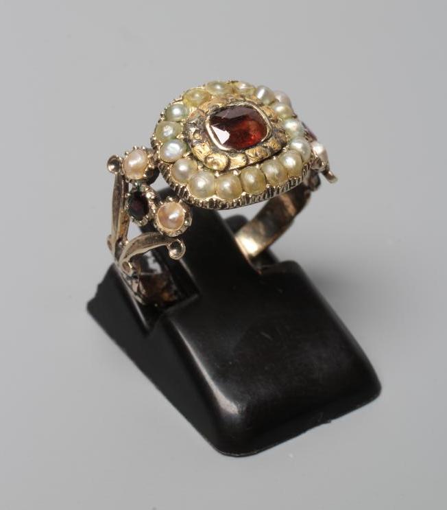 A GEORGIAN SEED PEARL AND GARNET MOURNING RING Image
