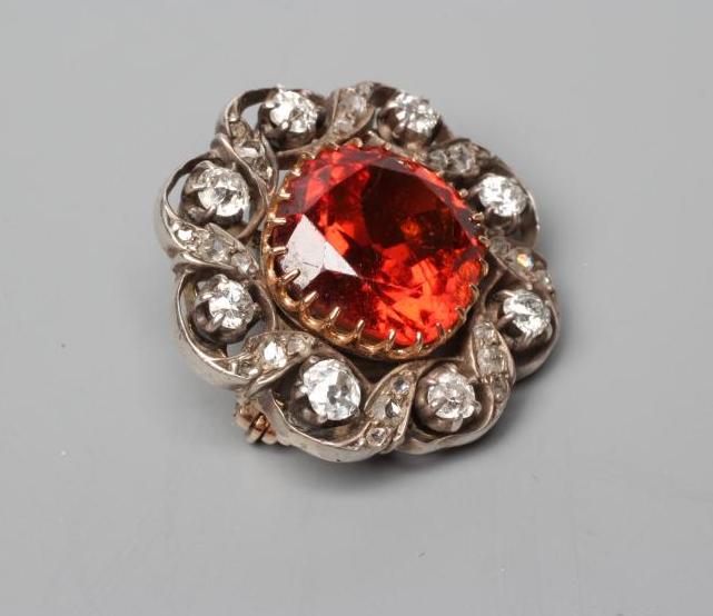 A LATE VICTORIAN HESSONITE GARNET AND DIAMOND BROOCH Image
