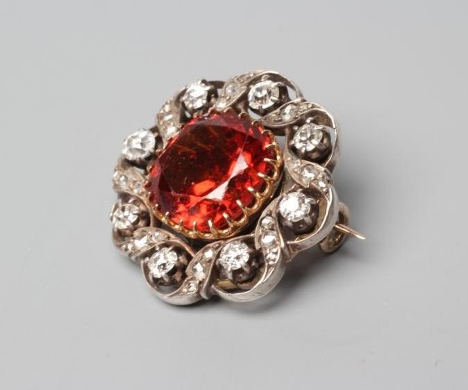 A LATE VICTORIAN HESSONITE GARNET AND DIAMOND BROOCH Image